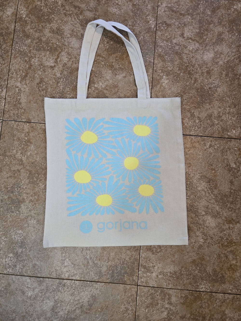Gorjana Cream Tote with Blue Daisy Print and Yellow Centers